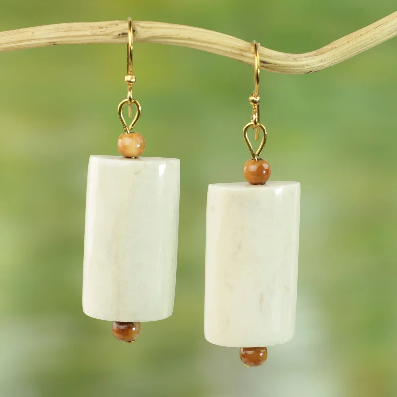 Classic hoop earrings with a thin profile for a sleek and subtle style-Glowing Path Hand Crafted Cow Bone Dangle Earrings from West Africa