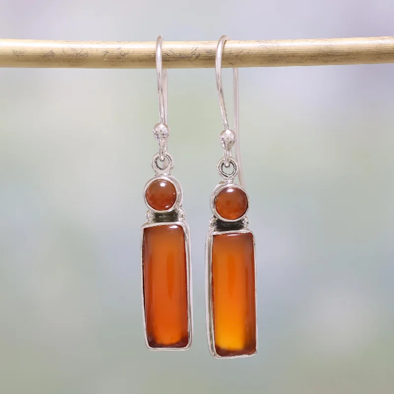 Hoop earrings with twisted metal designs for a dynamic and modern style-Radiant Allure Carnelian and Sterling Silver Dangle Earrings from India