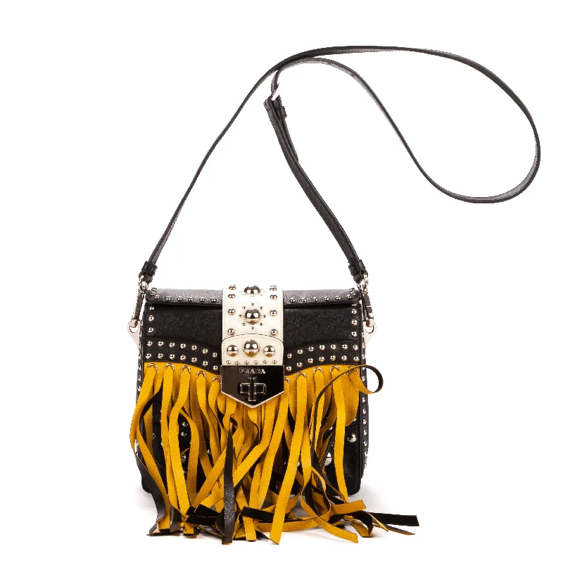 Handle bags with multi-color weaves for vibrancy -Fringe studs